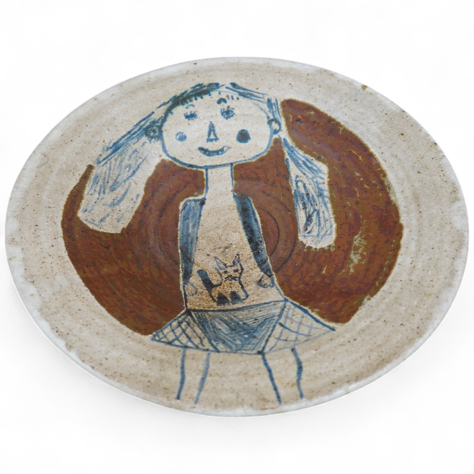 Eric James Mellon (1925-2014), a studio pottery dish, painted with a girl and cat, inscribed and dated 1971 to the foot rim, 29cm in diameter